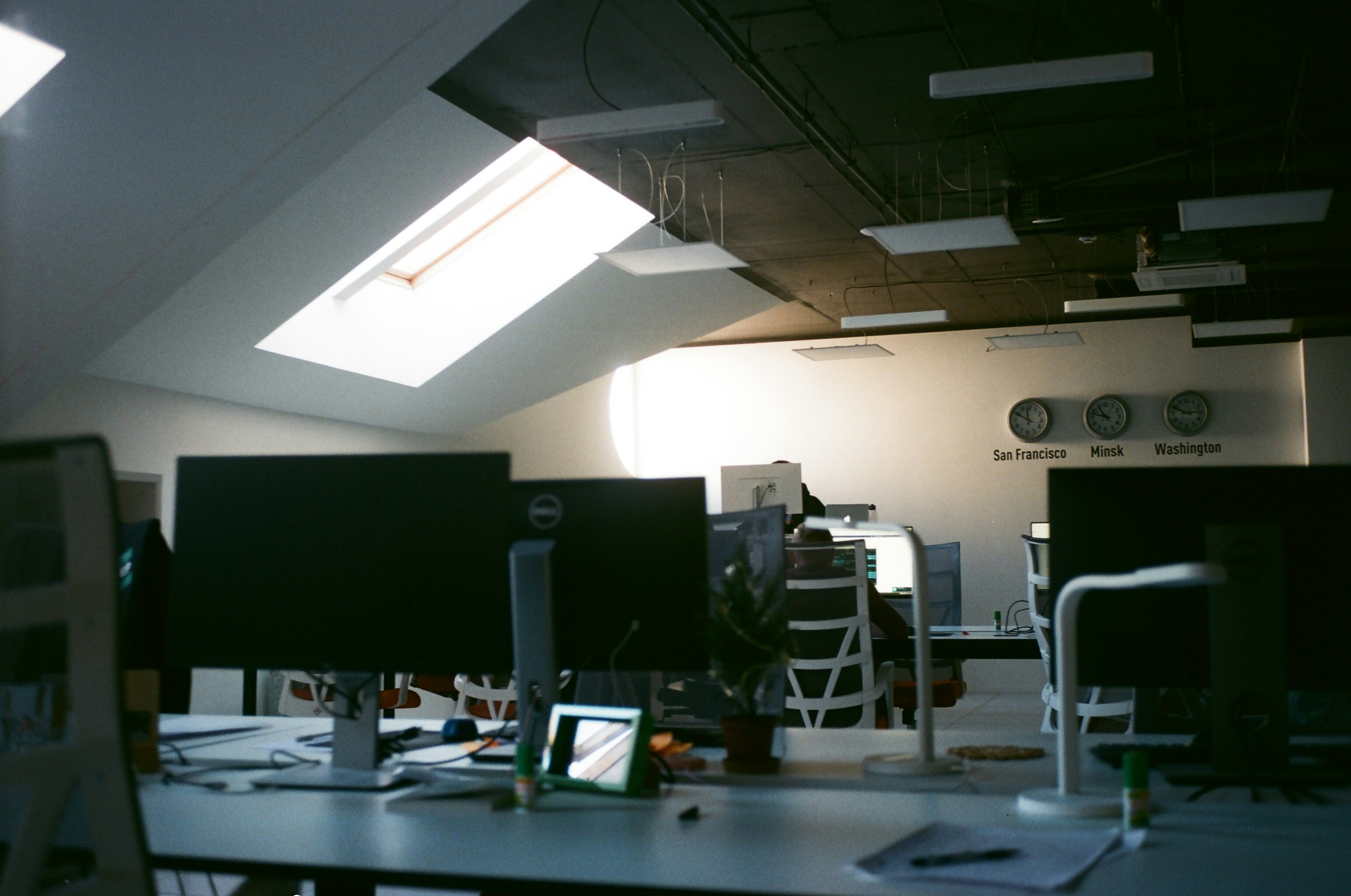 black flat screen computer monitor on black wooden desk
