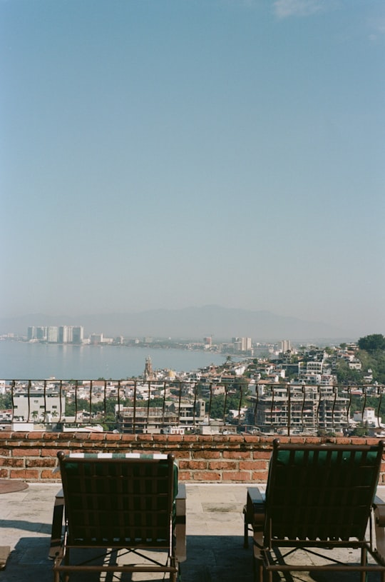 city skyline under gray sky during daytime in Puerto Vallarta Mexico