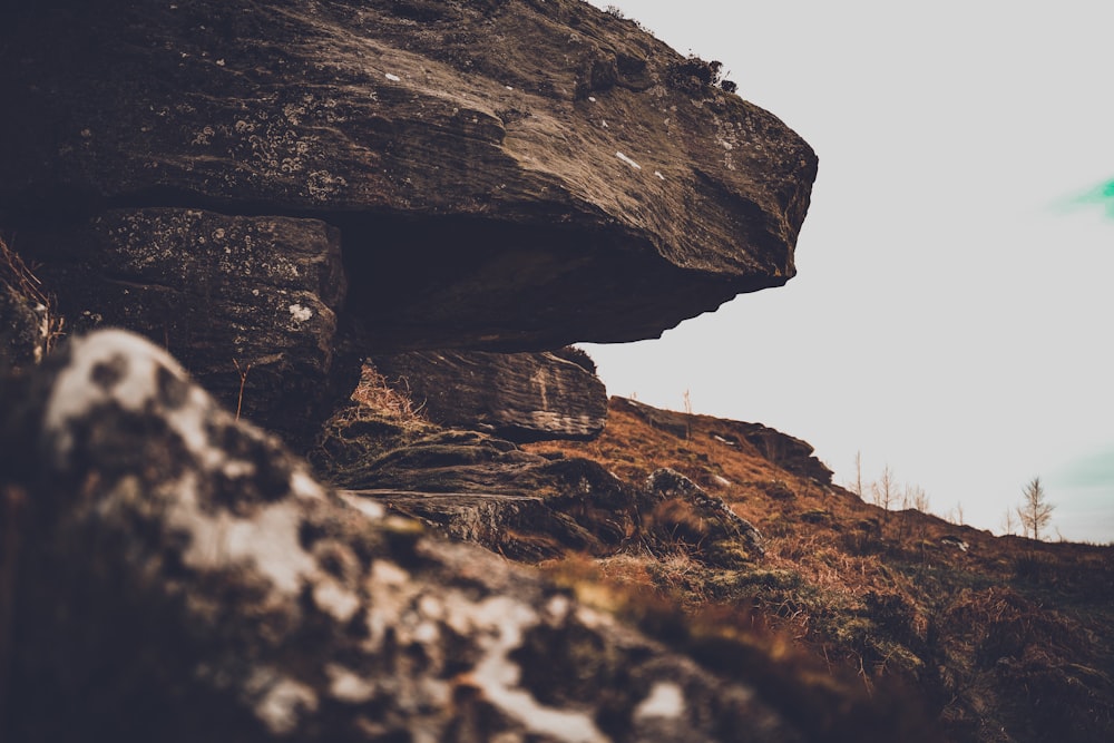 brown rock formation under white sky during daytime