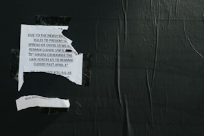 A university notice board displaying updated rules and deadlines for academic submissions