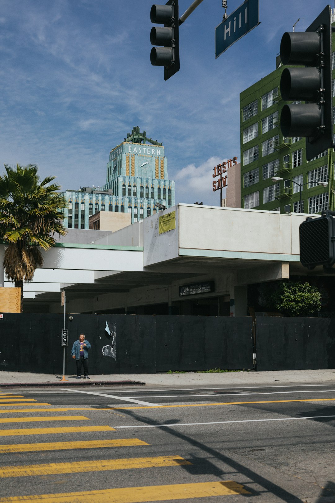 people walking on pedestrian lane near white concrete building during daytime