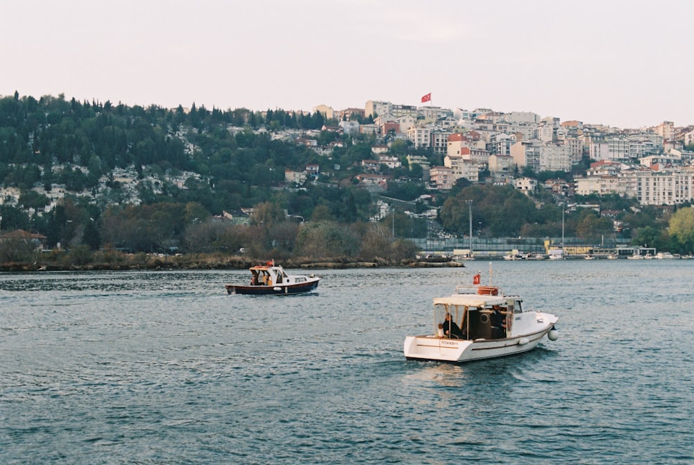 white and brown boat on sea during daytime