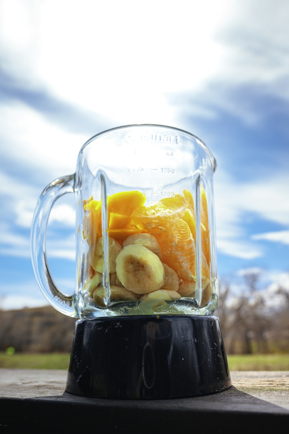 clear glass mug with black liquid inside