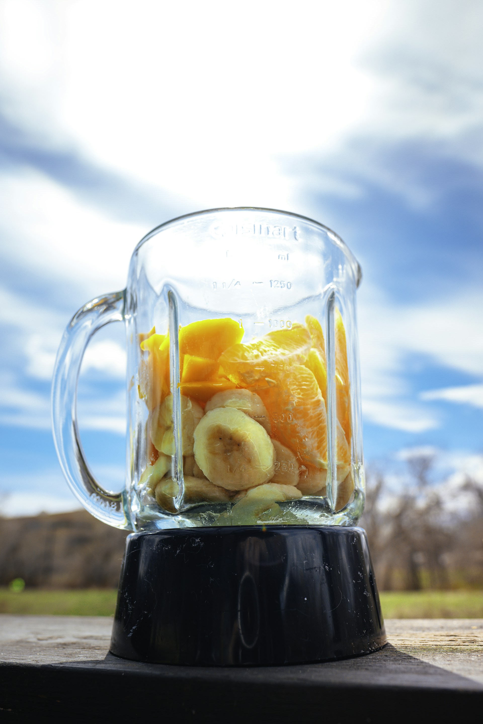 clear glass mug with black liquid inside