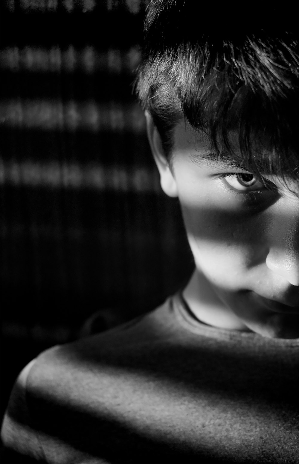 grayscale photo of boy in crew neck shirt