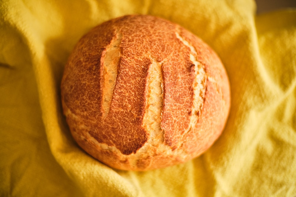 brown bread on yellow textile