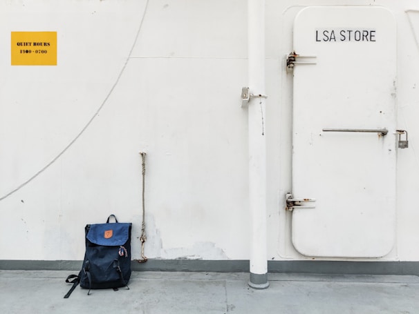 blue and black backpack on black luggage bag
