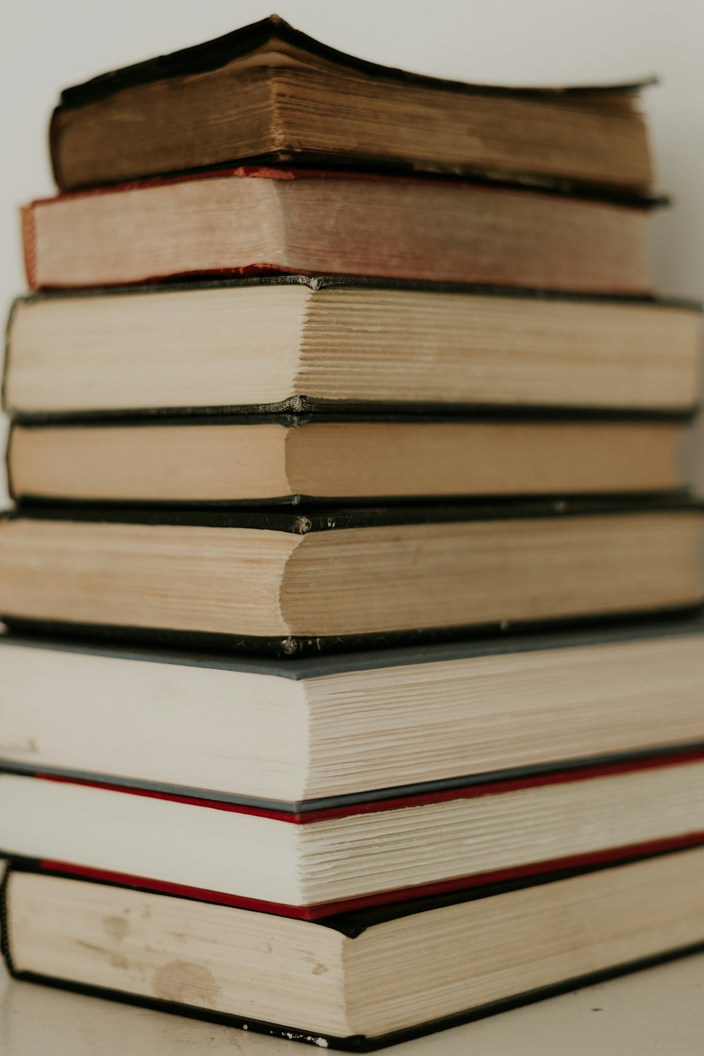 stack of books on blue table