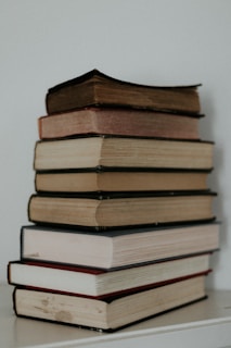 stack of books on white table