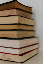 brown and white hardbound books