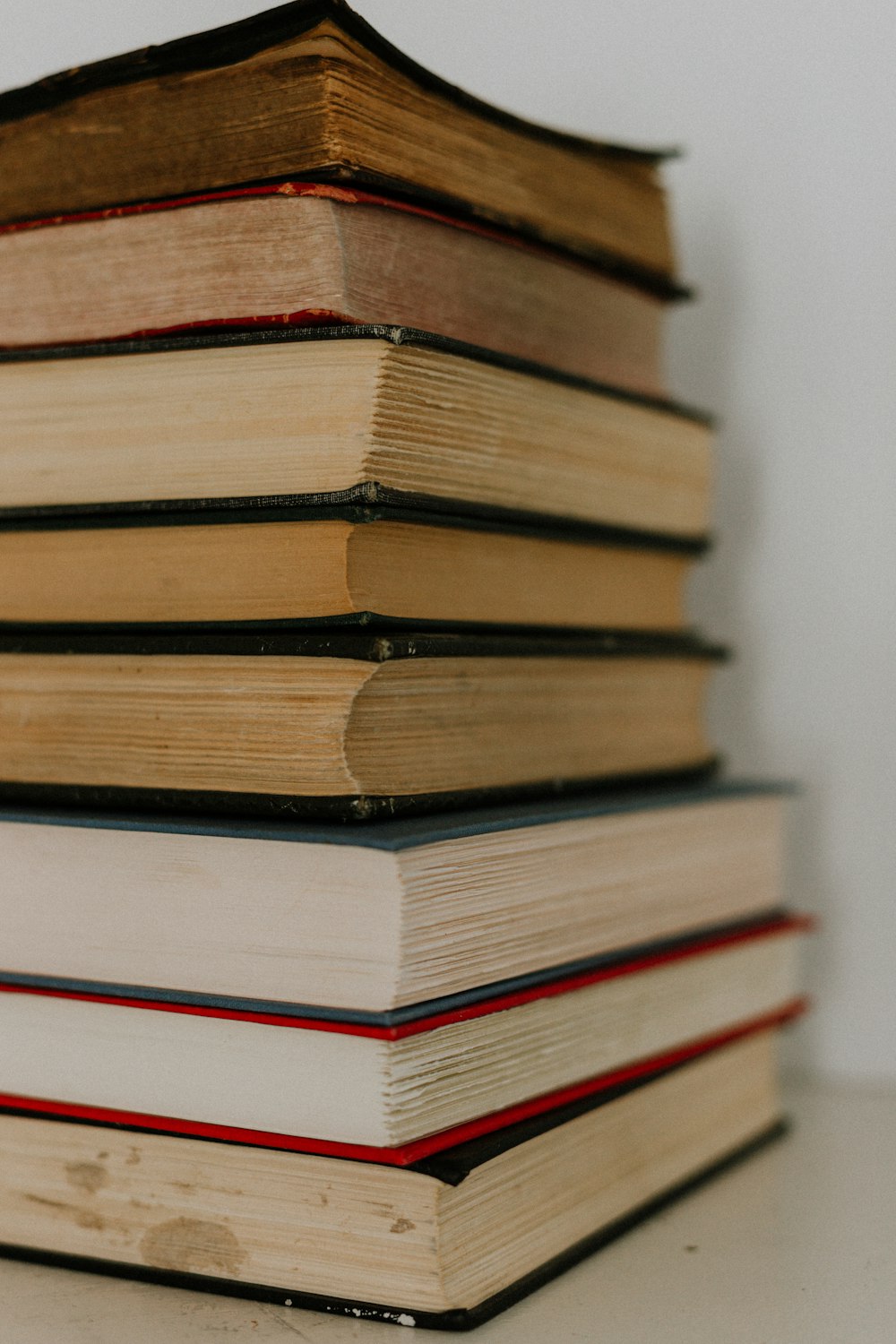 brown and white hardbound books