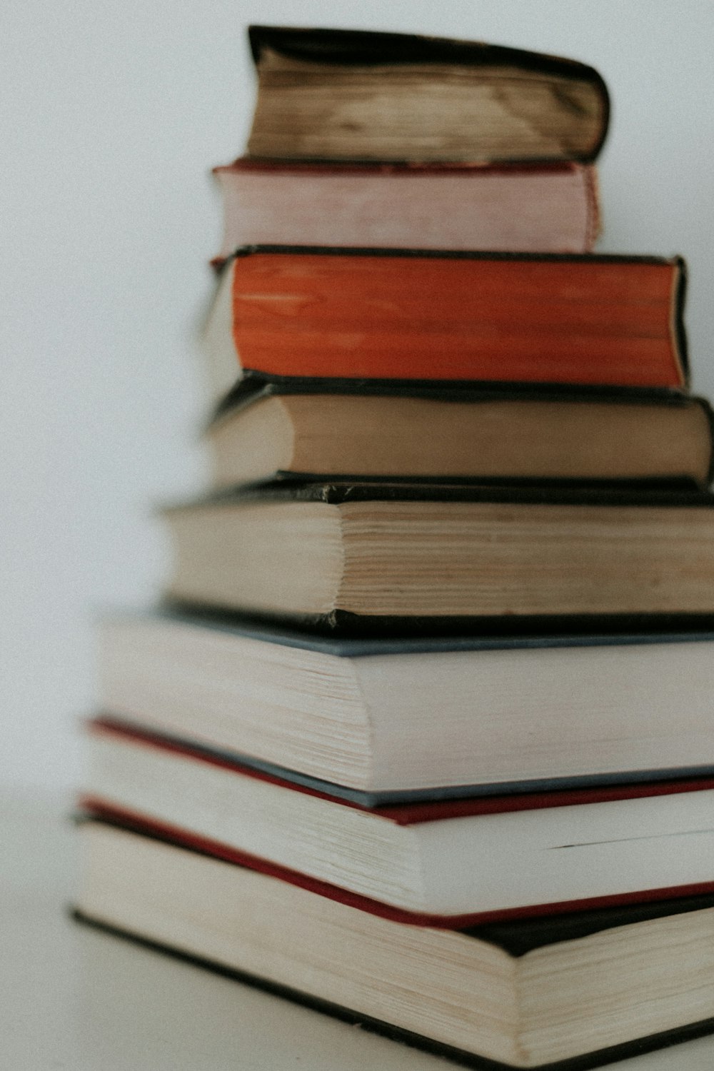 stack of books on white table