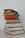 brown and red books on white surface