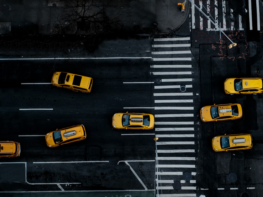 yellow and black cars on road