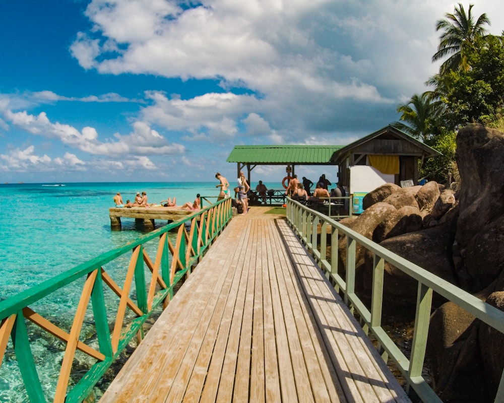 people walking on wooden dock during daytime