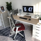 A well-organized workspace with a desk and comfortable chair.