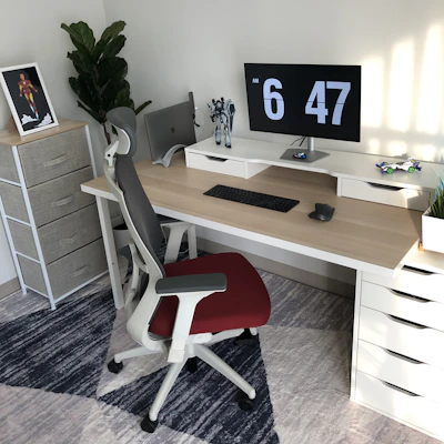 Industrial worker adjusting workstation setup with ergonomic tools