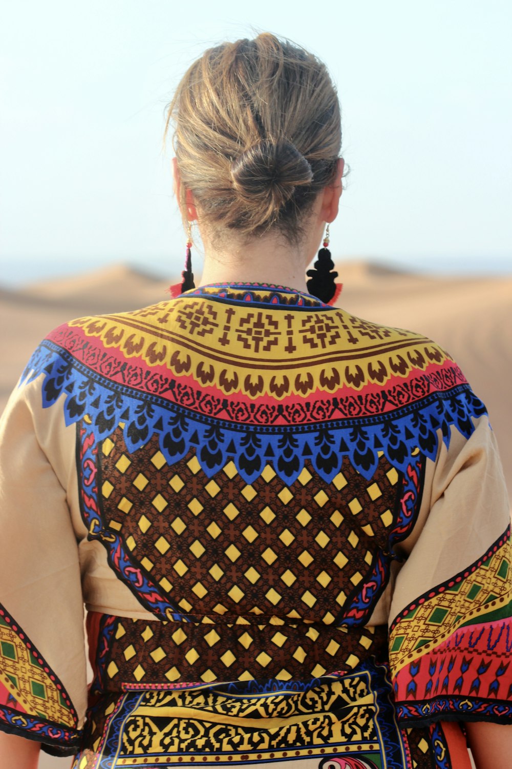 woman in brown and black tribal print shirt