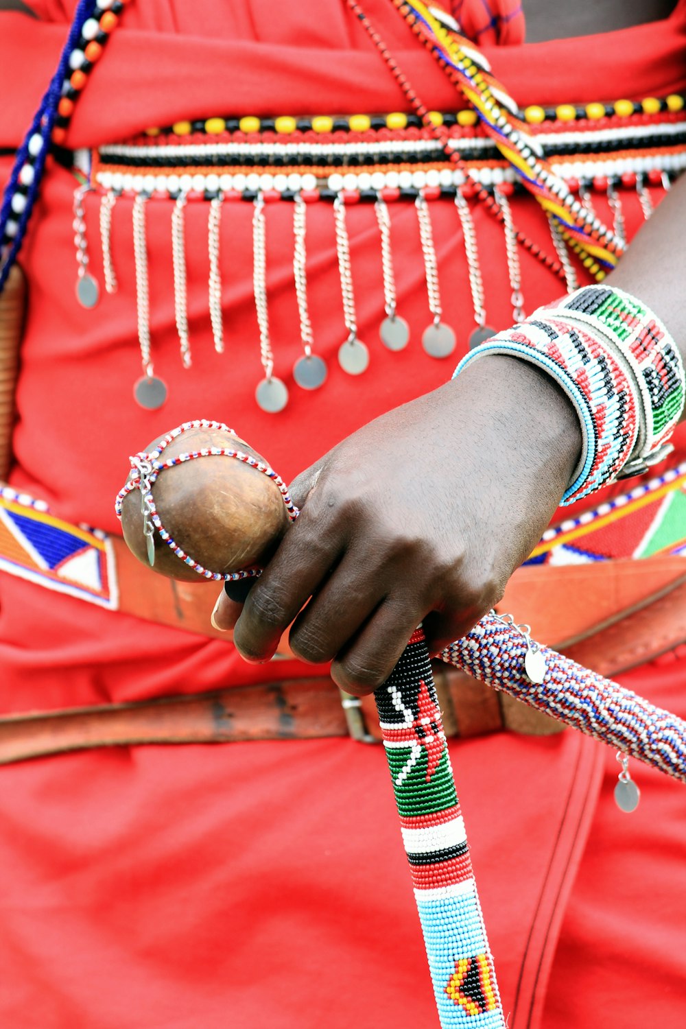 person wearing red white and blue bracelets