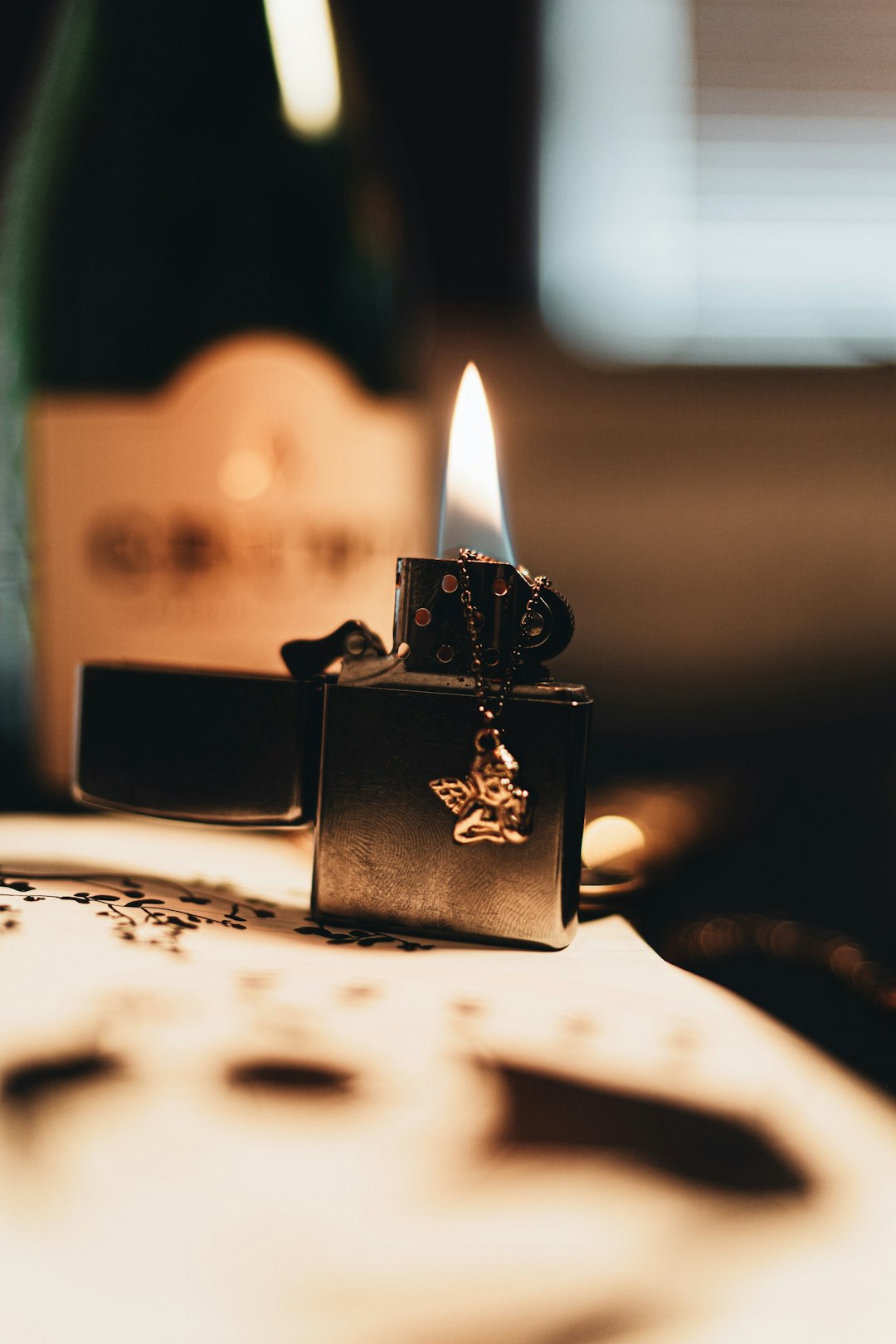 silver flip lighter with fire