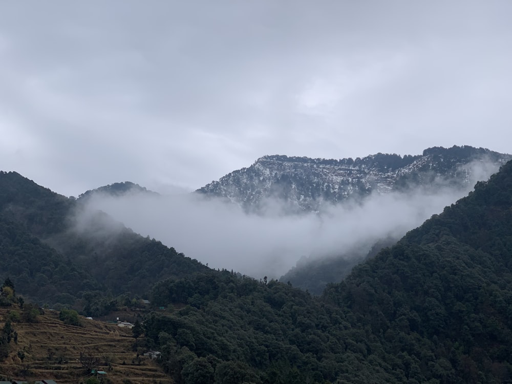 green mountains under white clouds during daytime