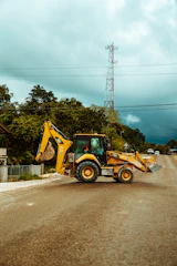 yellow and black heavy equipment on road during daytime