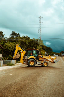 yellow and black heavy equipment on road during daytime
