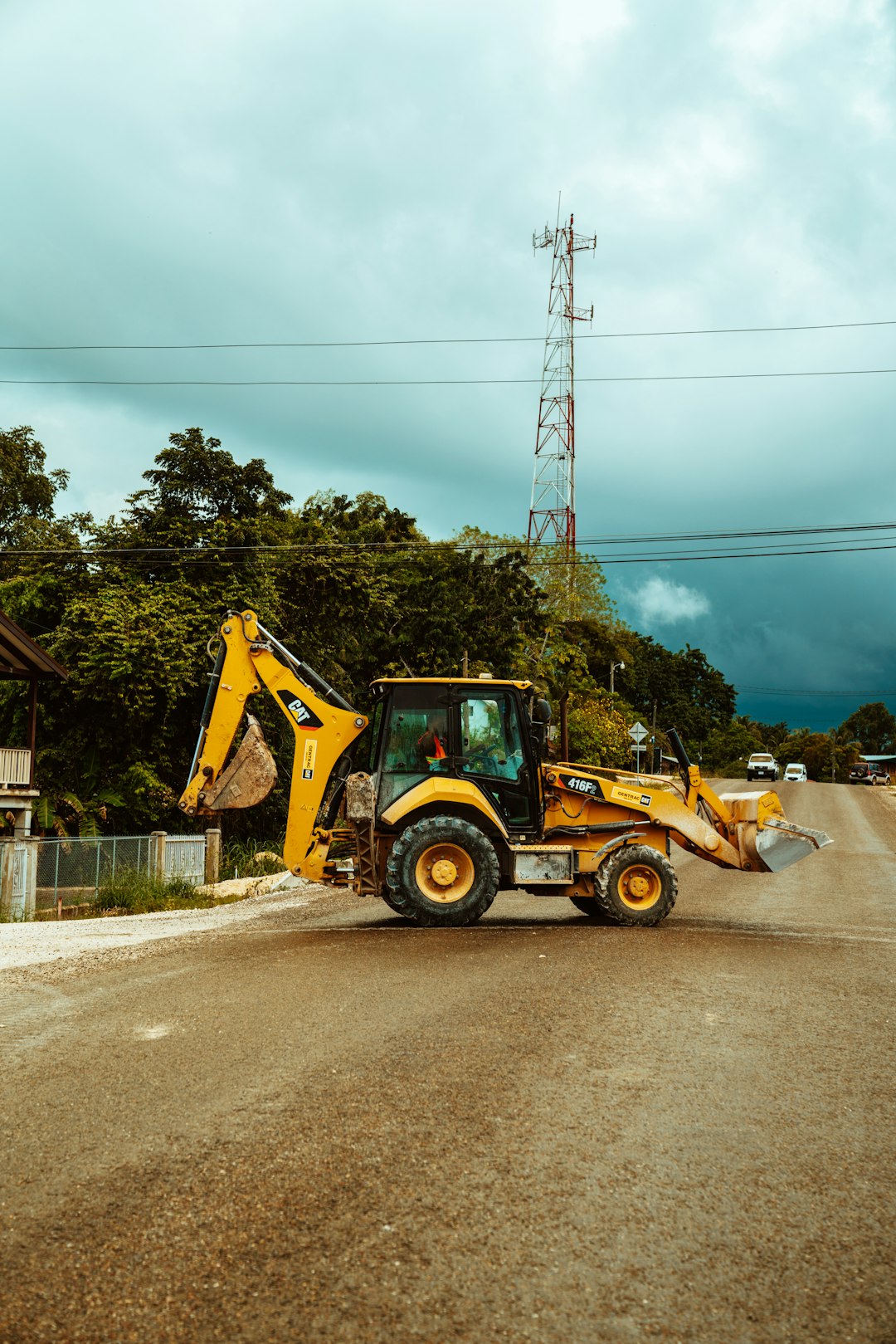 yellow and black heavy equipment on road during daytime