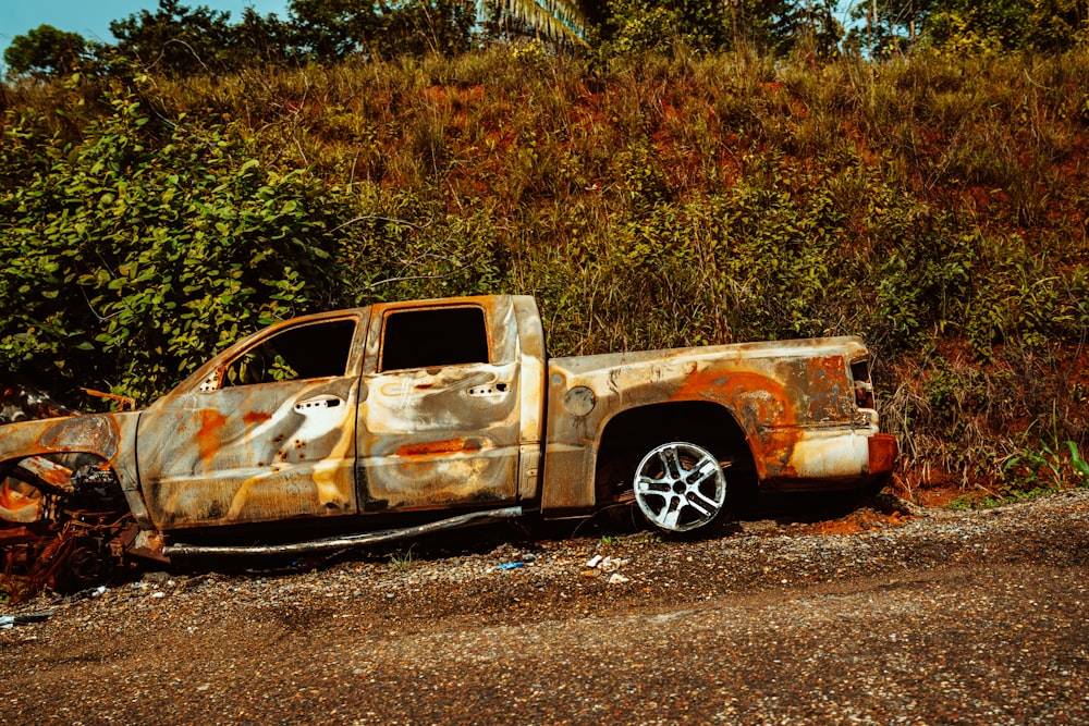 brown single cab pickup truck on brown soil