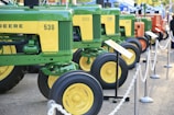 green and yellow tractor scale model