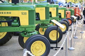 green and yellow tractor scale model