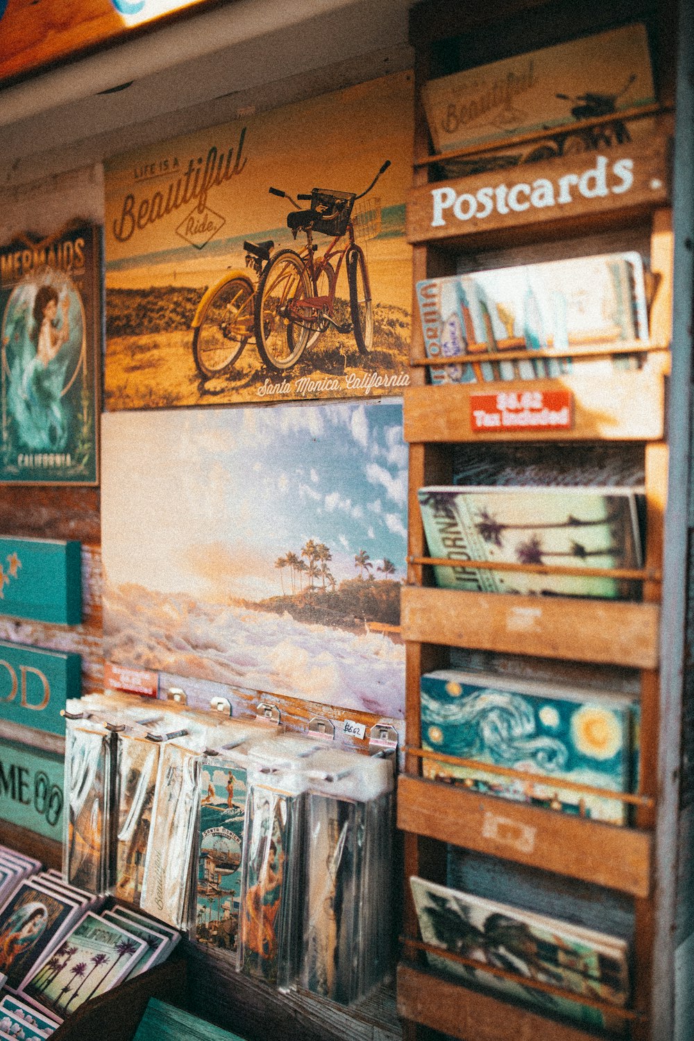 brown wooden shelf with books and photos