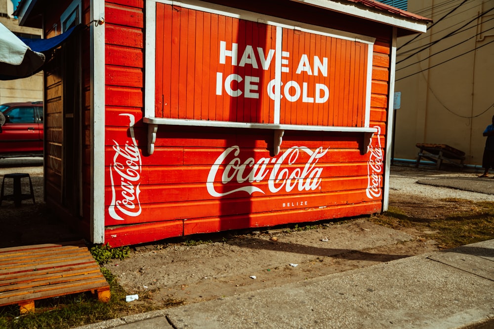 red and white coca cola wooden door