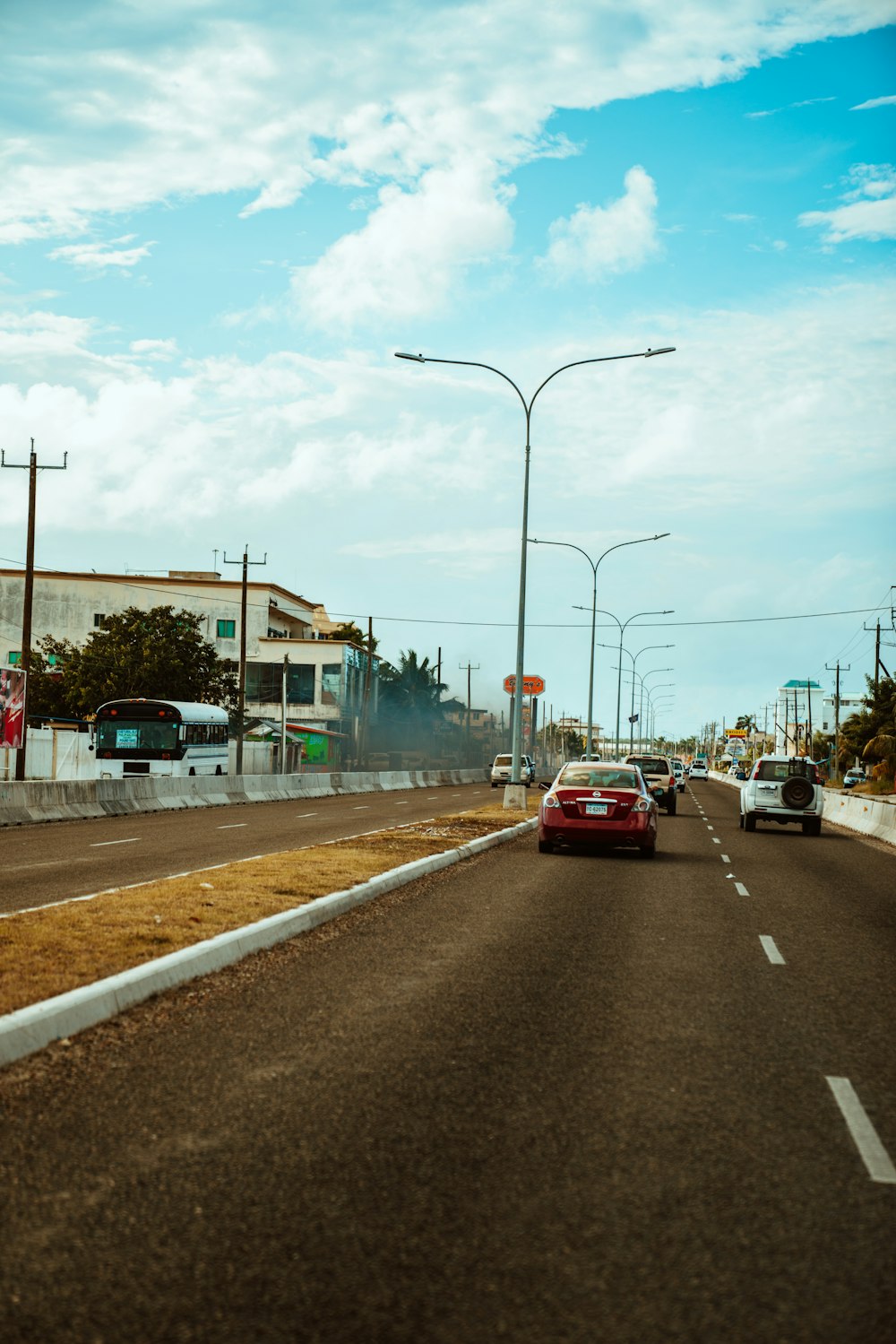 red car on road during daytime