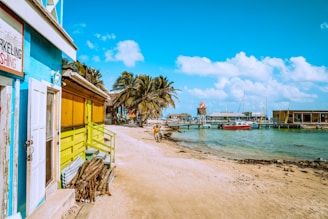 brown wooden beach chairs near body of water during daytime