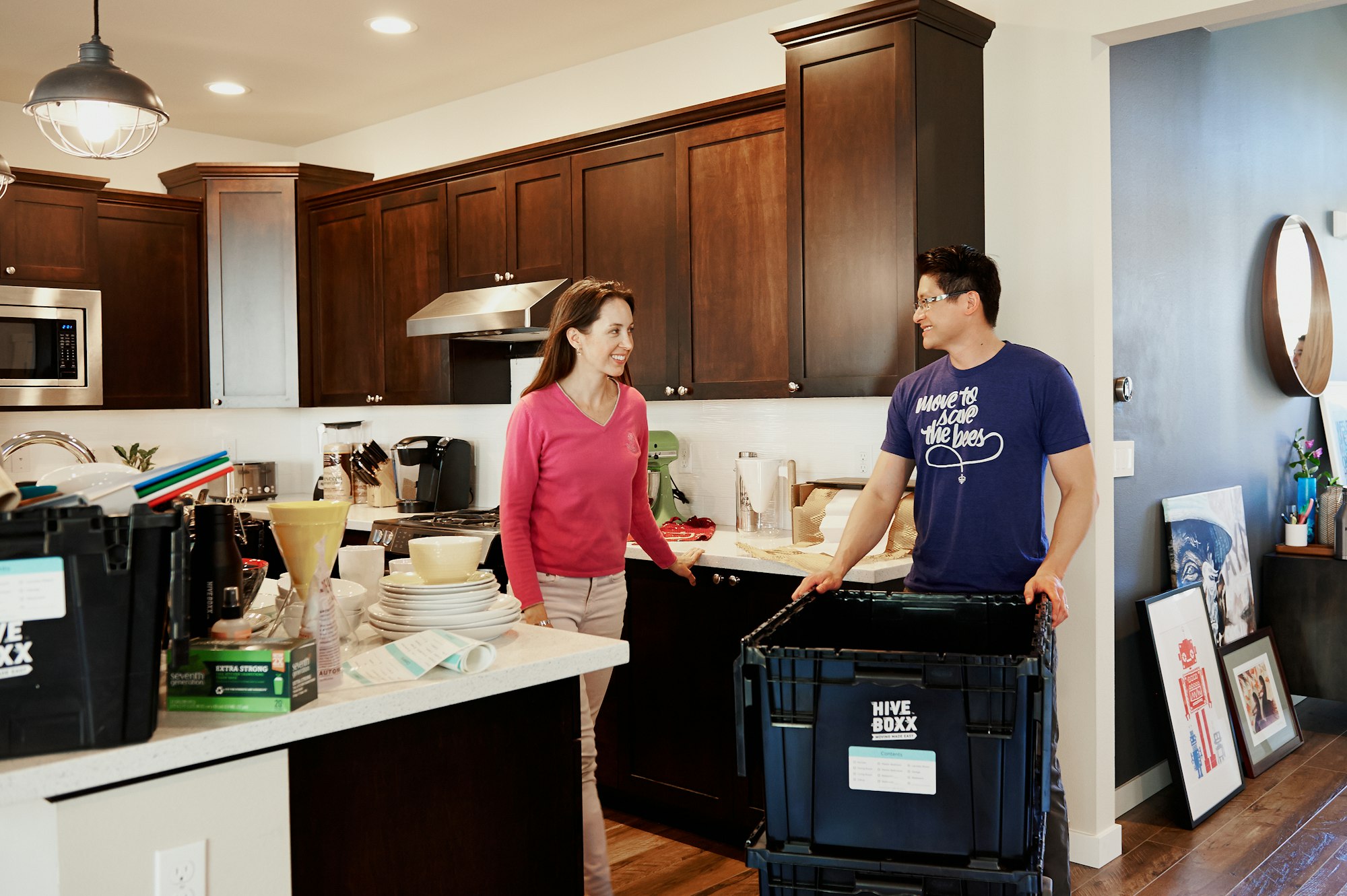 Couple cleaning the kitchen 