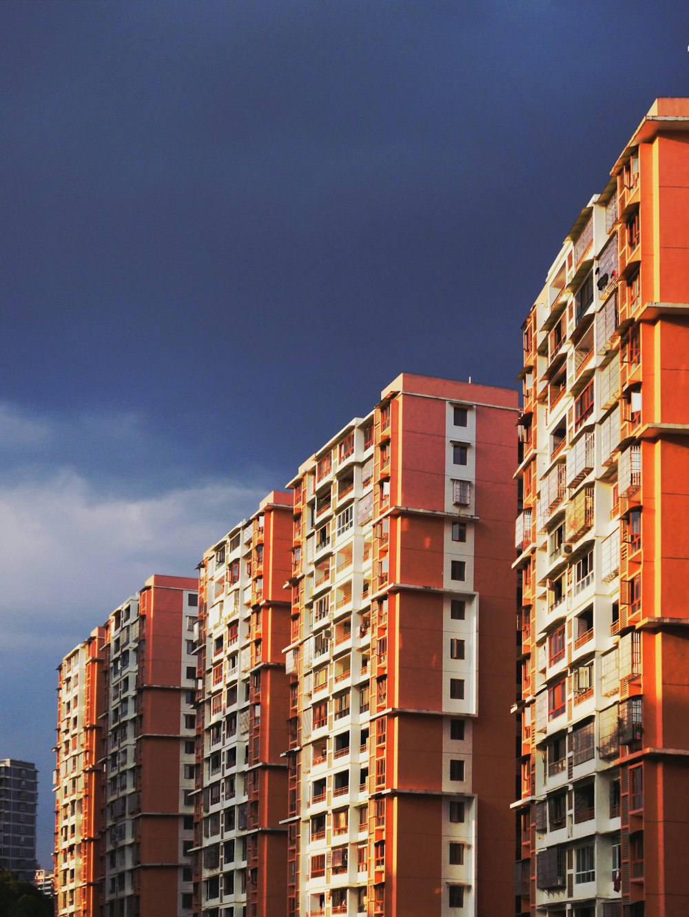 brown and beige concrete building under blue sky during daytime