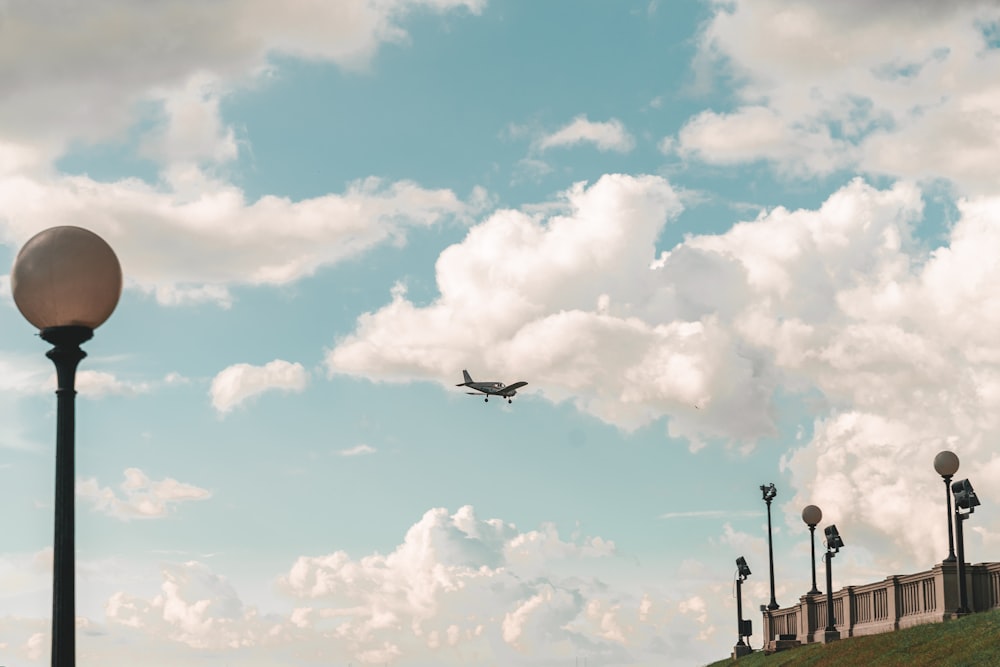 airplane flying over the city during daytime