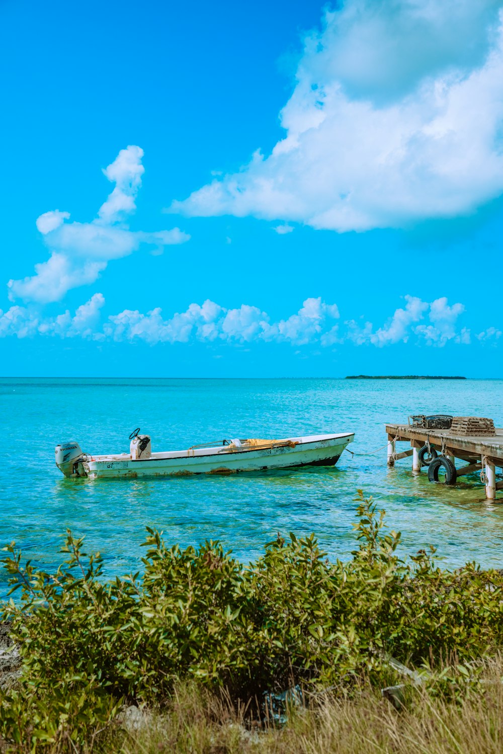 white and brown boat on sea during daytime