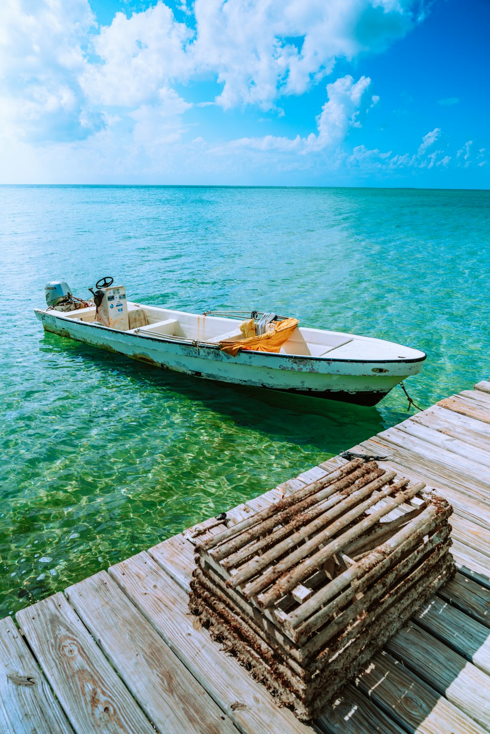 brown wooden boat on body of water during daytime