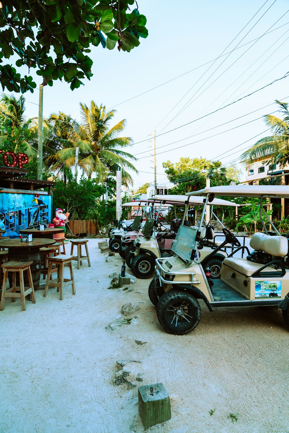 white and black golf cart on gray concrete road during daytime