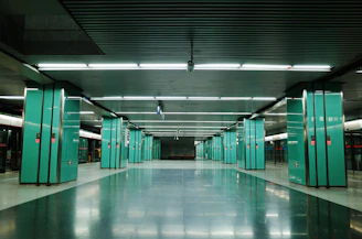 green and white hallway with green doors