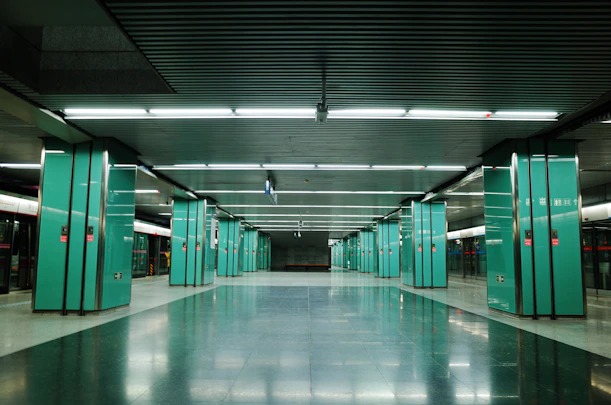 green and white hallway with green doors