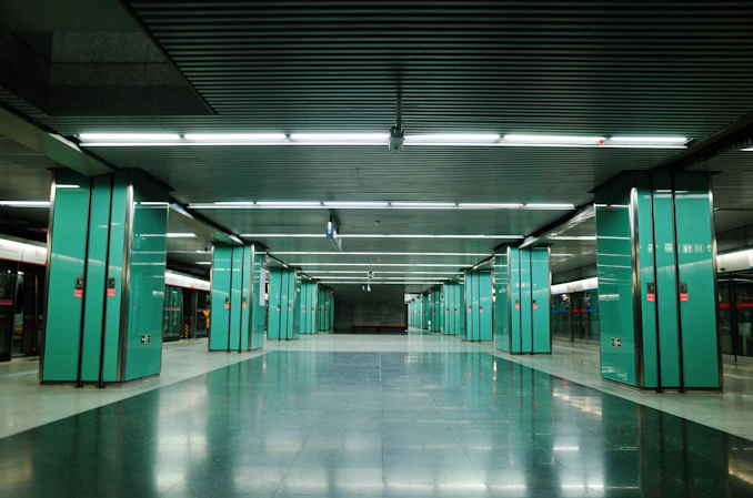 green and white hallway with green doors