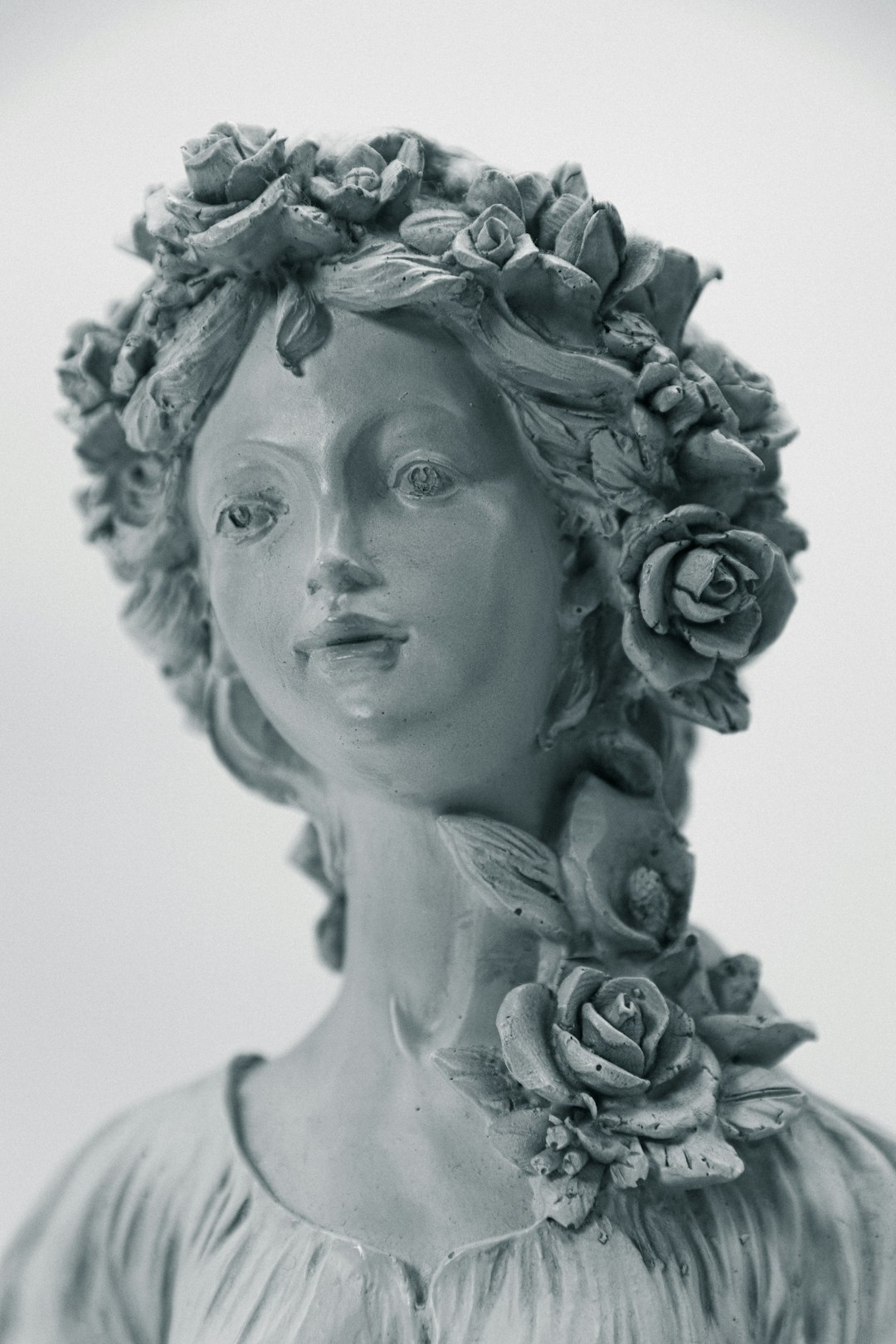 womans face with white flower headdress