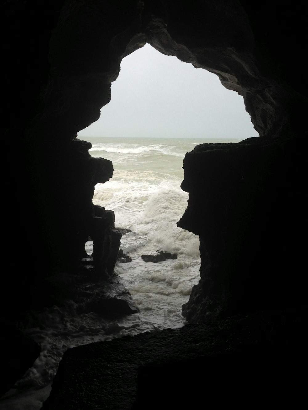 brown rock formation near sea during daytime