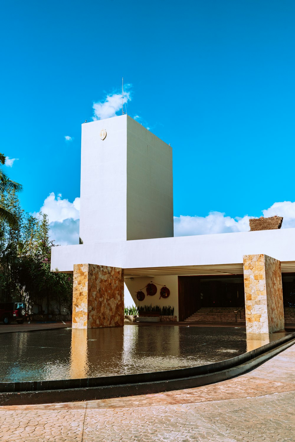 white concrete building near body of water during daytime