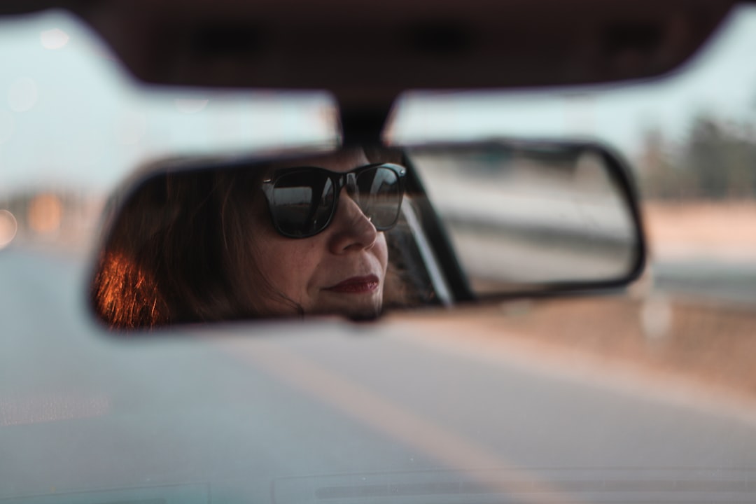 woman in black sunglasses in car