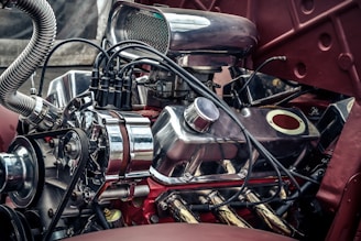 red and silver motorcycle engine