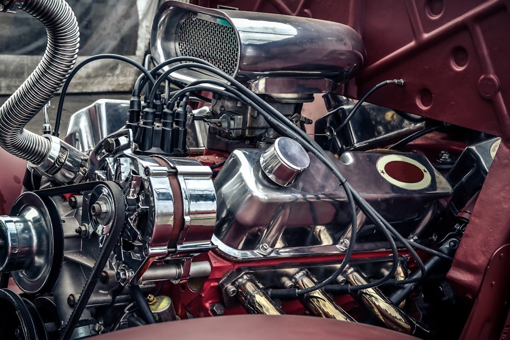 red and silver motorcycle engine